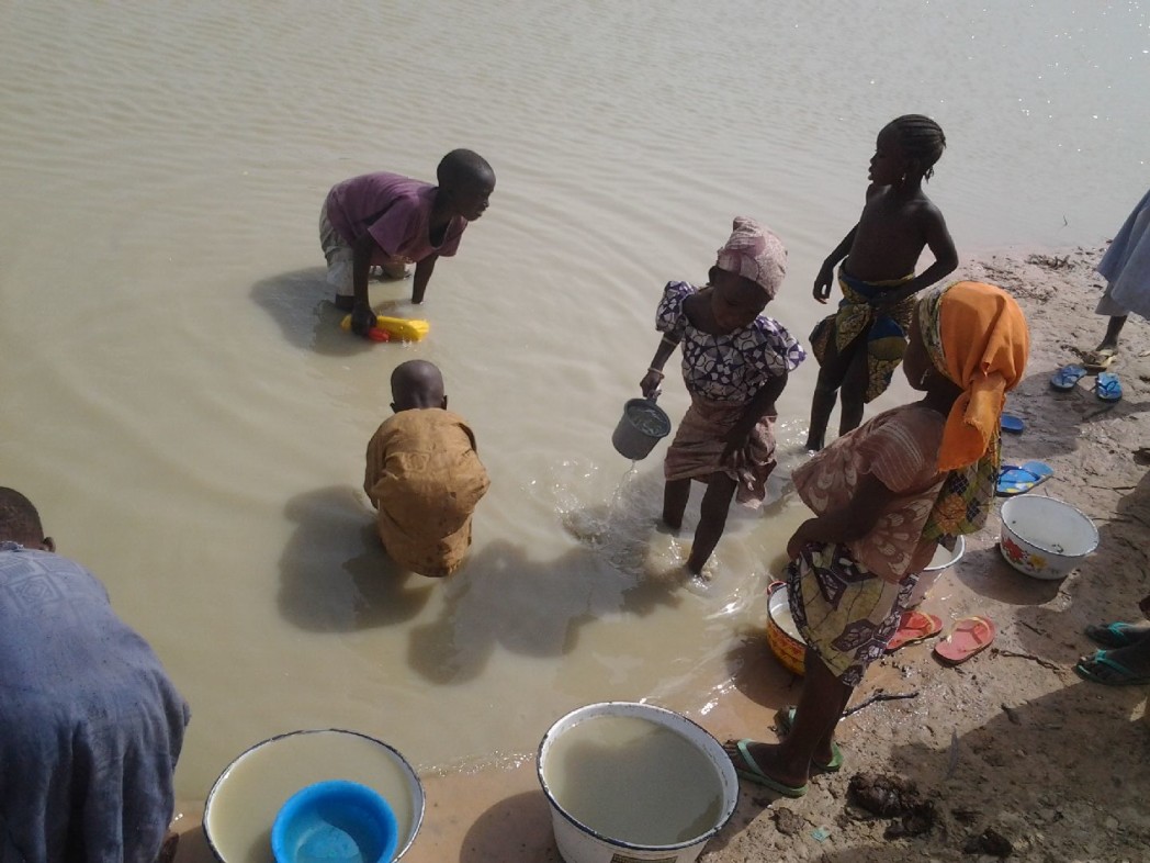 Children fetching dirty water