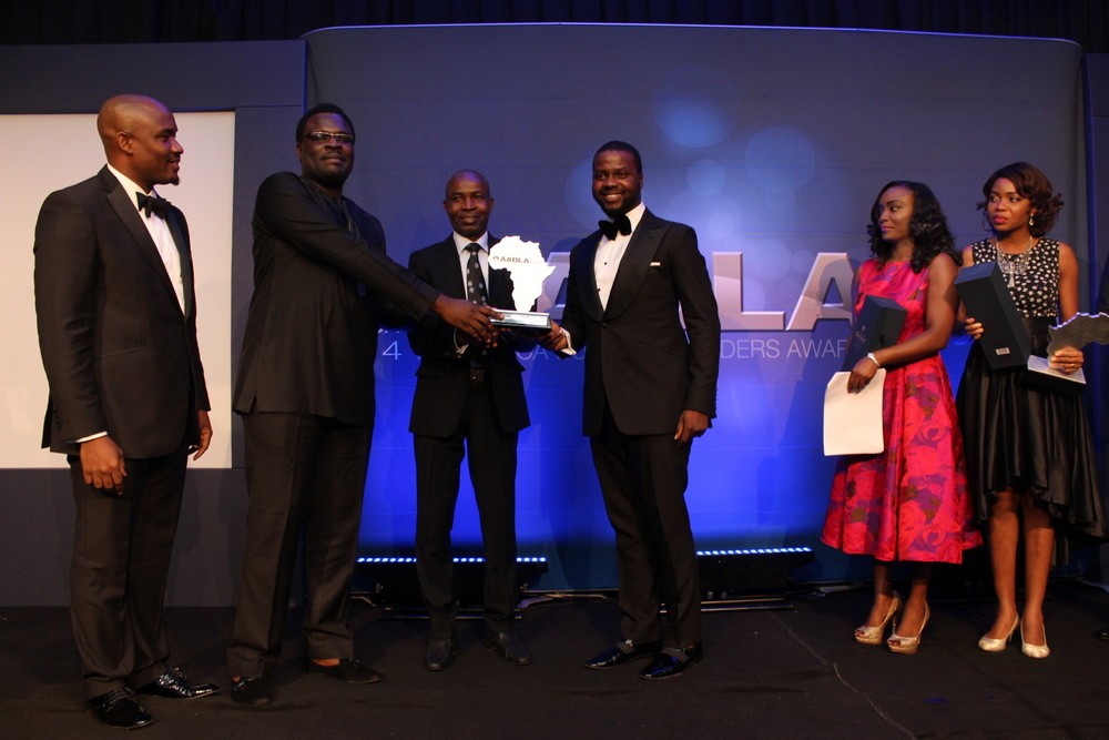 Chude Jideonwo and Adebola Williams receiving their award