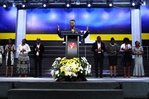 Sam Adeyemi leading congregation in worship